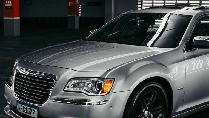 ProLite Auto Glass technician installing a Chrysler Pacifica windshield in Mesa