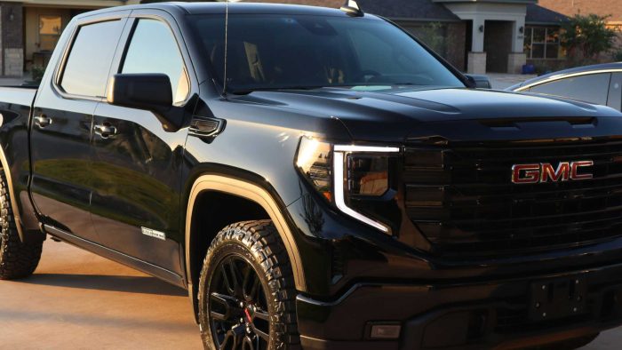 ProLite Auto Glass technician replacing rear glass on a GMC Sierra in Arizona