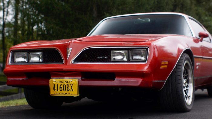ProLite Auto Glass technician replacing a Pontiac Firebird windshield in Arizona