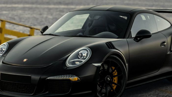 ProLite Auto Glass technician working on Porsche 911 glass in Arizona